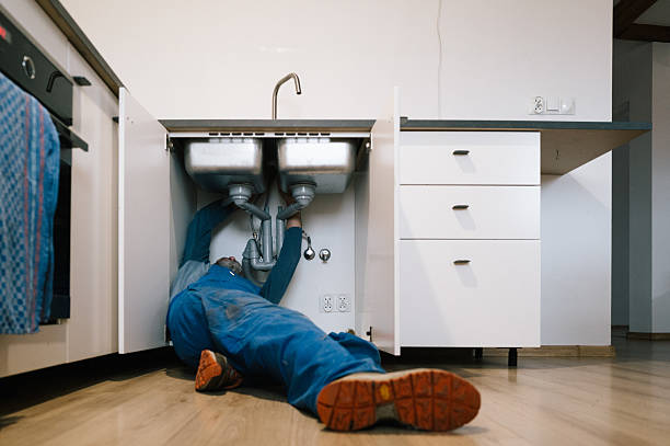 Professional Emergency Plumber technician working in Evergreen, MT